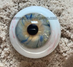 Blown glass eye in blue with veins